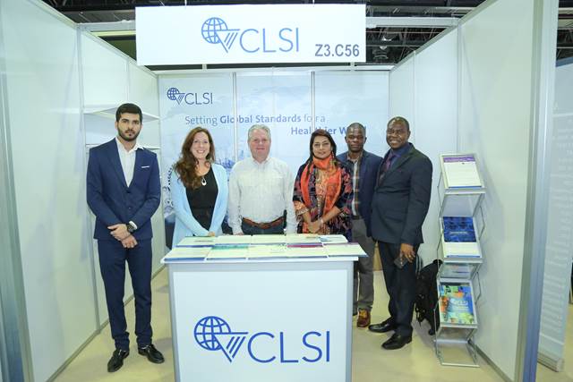 CLSI President, Dr. Victor Waddell and CEO, Dr. Barb Jones with CLSI staff at the company's stand at MedLab Middle East.